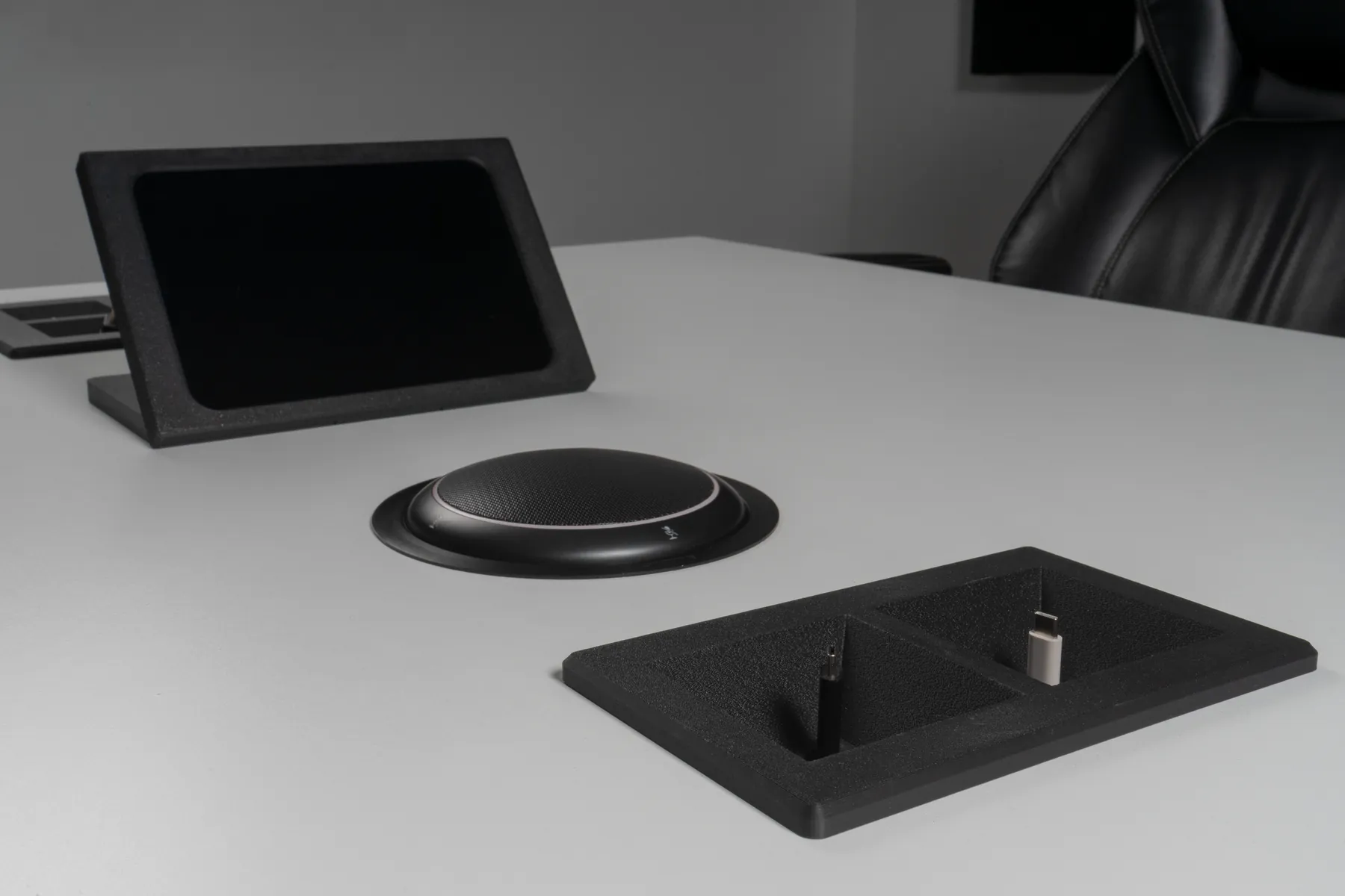 Charcoal Kubby Dos in the foreground with an iPad Mini Table Stand and speakerphone behind it